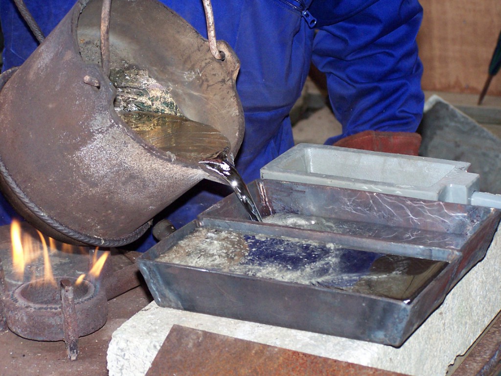 Showing how we pour ingots of Cornish tin