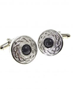 Cornish tin cuff links set with black stone cabochon.