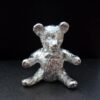 Sitting teddy cast in Cornish tin